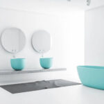 Turquoise soaker tub and matching on counter bowls and mirrors with all white floor and walls. Minimalist design.